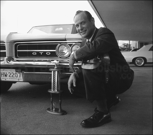 Jim Wangers poses with a '64 Goat